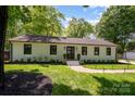 Well-maintained single story home featuring a lush green lawn at 5218 Addison Dr, Charlotte, NC 28211