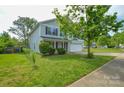 Charming two-story home with a well-manicured lawn at 5219 Biederbeck Dr, Charlotte, NC 28212