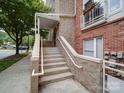 Exterior view of the condo entrance with stone steps and brick accents at 650 Raphael Pl, Charlotte, NC 28205