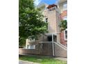 Attractive condo building exterior with a rooftop patio and brick and stone accents at 650 Raphael Pl, Charlotte, NC 28205