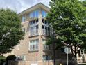 Modern condo building with stone facade, balconies, and ample natural light at 650 Raphael Pl, Charlotte, NC 28205