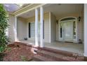 Inviting front porch with brick accents and classic white columns at 777 Sanside Dr, York, SC 29745