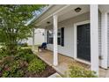 Inviting front porch with seating and a 'HOME' doormat, creating a cozy entrance at 1218 Juddson Dr, Waxhaw, NC 28173
