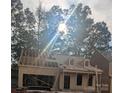 Exterior view of a new construction home with wood framing under a sunny sky at 124 Canary Ln # 7, Mooresville, NC 28115