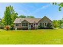 Back exterior featuring a deck with white railing and windows at 1374 Weatherby Dr, Salisbury, NC 28146
