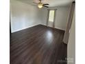 Bright and airy living room features sleek floors, a ceiling fan, and natural light at 155 Ervin Loop, China Grove, NC 28023