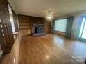 Spacious living room with hardwood floors, fireplace and built-in shelves at 1620 Moss Springs Rd, Albemarle, NC 28001
