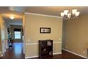 Inviting foyer with hardwood floors, decorative lighting, and open access to living spaces at 1905 Yellow Daisy Dr, Matthews, NC 28104