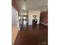 Spacious entryway with hardwood floors and neutral paint tones throughout at 1905 Yellow Daisy Dr, Matthews, NC 28104