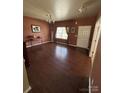 Inviting living room with hardwood floors, natural light, and cozy atmosphere at 1905 Yellow Daisy Dr, Matthews, NC 28104