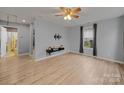 Bright and airy living room with modern flooring, a ceiling fan, and lots of natural light at 268 Jefferson Ne Ct, Concord, NC 28025