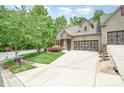 View of the home from across the street, showcasing the well-kept lawn and lush greenery surrounding the property at 3004 Village Ridge Dr, Gastonia, NC 28056