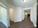 Spacious foyer with beautiful wood floors and molding, leading into the home's open living spaces at 3022 Cedar Falls Dr # 16, Waxhaw, NC 28173