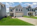 Well-manicured lawn complements this two-story home, featuring a two-car garage and classic design at 334 Bluebonnet Dr, Salisbury, NC 28146