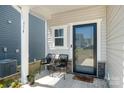 Cozy front porch with seating and a decorative entrance, welcoming you home at 334 Bluebonnet Dr, Salisbury, NC 28146