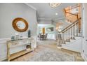 Open foyer showcases a staircase, wood floors, and access to the dining area for seamless flow at 349 Miners Cove Way, Fort Mill, SC 29708