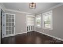 Bright office space with built-in shelving, stylish French door, and ample natural light at 3755 11Th Ne St, Hickory, NC 28601