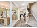Inviting foyer showcasing an open floor plan with hardwood floors and staircase, blending style and functionality at 3939 Archer Notch Ln, Huntersville, NC 28078