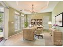 Inviting home office featuring natural light from a large window, custom shelves and desk at 3939 Archer Notch Ln, Huntersville, NC 28078