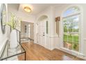 Lovely foyer with hardwood floors, arched doorway, and a view of the front lawn at 426 Walden Trl, Waxhaw, NC 28173