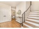 Inviting foyer with hardwood floors, stairs, and views into other living spaces at 426 Walden Trl, Waxhaw, NC 28173
