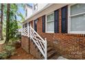 A close up of the brick work on a charming home with white trim and black shutters at 721 Summerwood Dr, Rock Hill, SC 29732