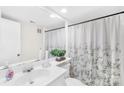 Bathroom featuring a white vanity, large mirror, and shower with decorative curtain at 7407 Mystic Ln, Charlotte, NC 28227