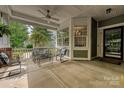 Relaxing front porch with comfortable seating, ceiling fan, and great views, perfect for enjoying the outdoors at 1000 Millbank Dr, Matthews, NC 28104