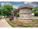 Stone Arbor Mere entrance sign with pergola and lush landscaping welcoming residents at 10707 Charmont Pl, Huntersville, NC 28078