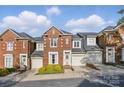 Charming brick townhouse with a well-maintained front yard and attached garage at 1139 Hampton Gardens Ln, Charlotte, NC 28209