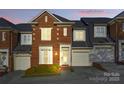 Charming brick townhouse with a well-maintained front yard and attached garage at 1139 Hampton Gardens Ln, Charlotte, NC 28209