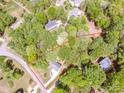 Aerial view of a large lot surrounded by lush greenery at 142 Gray Barn Dr, Troutman, NC 28166