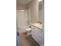 Bathroom with a granite vanity, white cabinets, and a shower-tub combination with white tiles at 200 N Kayla Dr, Salisbury, NC 28146