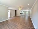 Open-concept living area with new wood floors, ceiling fan, and lots of natural light at 296 Tram Rd, Lancaster, SC 29720