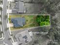 Aerial view of property lines showcasing a private backyard with mature trees at 3017 Winged Teal Ct, Belmont, NC 28012