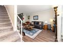 Cozy living room with plush seating, a stylish rug, and staircase at 3726 Park Rd, Charlotte, NC 28209