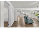 Bright living room with hardwood floors, a ceiling fan, and comfortable seating at 4304 S Falls St, Gastonia, NC 28056