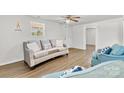 Comfortable living room with a plush sofa, stylish pillows, and hardwood floors at 4304 S Falls St, Gastonia, NC 28056