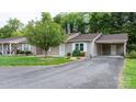Well-maintained home with a front yard, tree, neutral siding, and convenient carport at 505 2Nd Street Ne Pl # C4, Conover, NC 28613