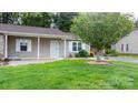 Home's lovely curb appeal featuring well-kept front yard and decorative tree at 505 2Nd Street Ne Pl # C4, Conover, NC 28613