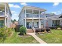 Charming two-story home featuring double porches and a well-maintained lawn at 507 E Main St, Rock Hill, SC 29730