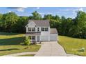 Beautiful exterior view of a well-maintained two-story home with a lush green lawn at 548 Dutch White Dr, Clover, SC 29710