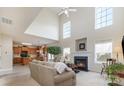 Open-concept living room featuring a fireplace and view into the adjacent kitchen at 5803 Lindley Crescent Dr, Indian Trail, NC 28079