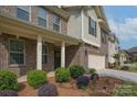 Inviting front porch with decorative columns, manicured landscaping, and a welcoming entrance to the home at 866 Tyne Dr, Fort Mill, SC 29715