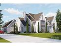 Elegant home features a long driveway and manicured landscaping, plus a three-car garage at 8716 Ruby Hill Ct, Waxhaw, NC 28173