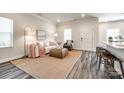 Well-decorated living room showcasing contemporary furnishings, a cozy rug, and ample natural light at 13210 Kenworth Rd, Charlotte, NC 28278