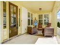 Inviting front porch with comfortable seating and an artistic easel setup at 1507 Riverwalk Pkwy, Rock Hill, SC 29730