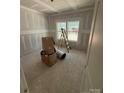 Unfinished bedroom displaying new construction with window letting in natural light at 15700 Stokes Ferry Rd, Richfield, NC 28137
