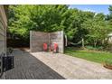 Backyard featuring a stamped concrete patio with privacy screen, seating and a hammock at 2006 Holly Villa Cir, Indian Trail, NC 28079