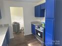 Kitchen showcasing stainless steel appliances, granite countertops, and painted cabinets at 201 Harley St, Wadesboro, NC 28170
